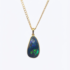 Handcrafted Semi-black-boulder-opal pendant, hand-set in polished gold, on a 50ct 9ct curb chain.
