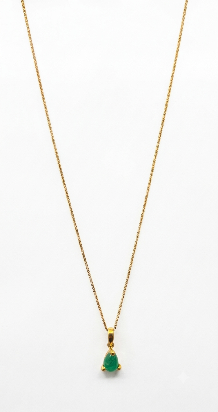 Ines1789317460597(1) 9ct Yellow Gold necklace with a pear-cut cabochon Emerald pendant suspended from a 9ct yellow gold wheet chain.