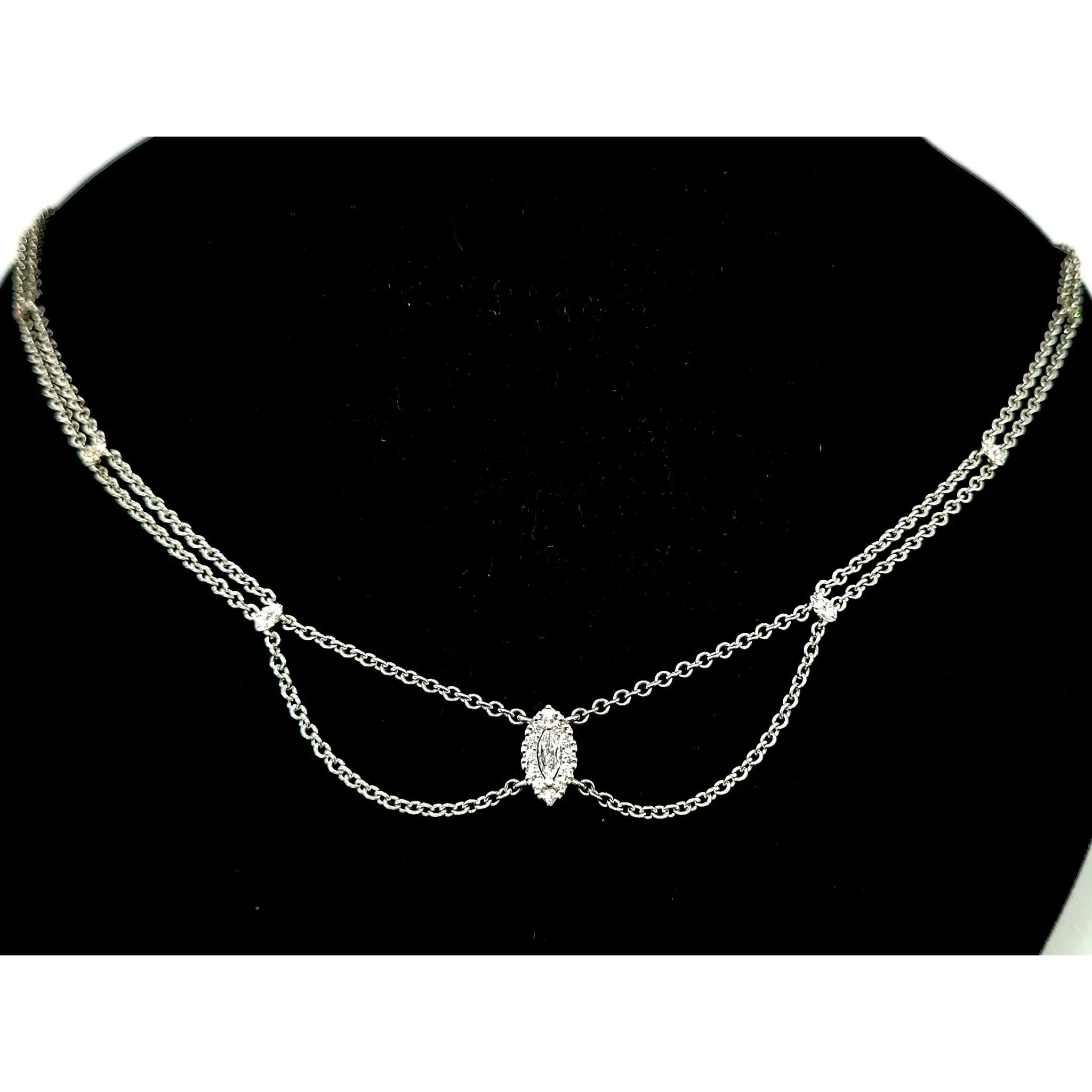 Izusa 18ct white gold pendant with marquise cut diamond and diamond spacers on a rolo chain.