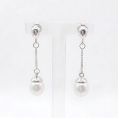 A pair of sterling silver drop Freshwater Pearl earrings featuring small, polished teardrop-shaped studs at the top. A delicate silver chain hangs from each stud, ending in a round white pearl topped with a small silver cap. With push on butterflies.