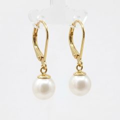 A pair of elegant drop earrings featuring drop, creamy white freshwater pearls suspended from delicate gold plated French hooks.