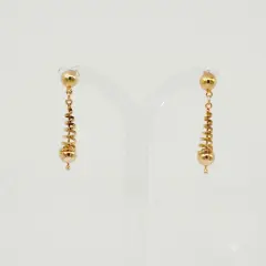 A pair of polished 9ct yellow gold dangle earrings. Each earring features a small gold bead at the top, leading to tapered, spiral-shaped center section that ends with a larger smooth gold sphere and a tiny accent bead at the very bottom.