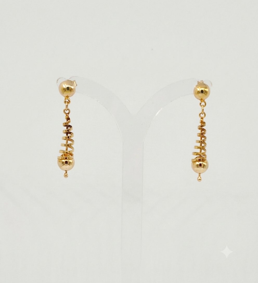 A pair of polished 9ct yellow gold dangle earrings. Each earring features a small gold bead at the top, leading to tapered, spiral-shaped center section that ends with a larger smooth gold sphere and a tiny accent bead at the very bottom.