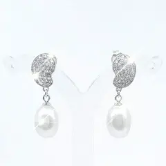 A pair of silver-toned drop earrings featuring a textured, leaf-shaped top encrusted with sparkling Cubic Zirconia's. Each earring is finished with an oval white Freshwater pearl that catches a bright, brilliant sparkle. With push on butterflies.