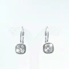 A pair of silver-toned drop earrings with cushion-cut cubic zirconia stones.