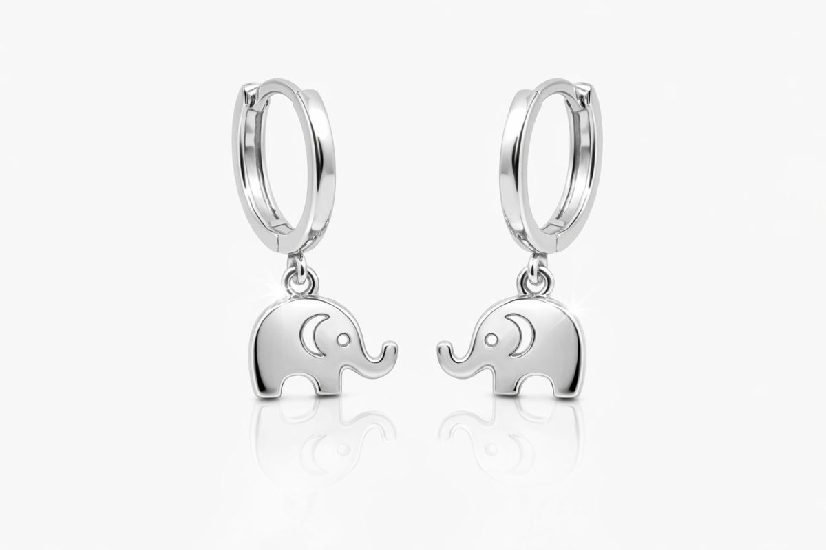 Pair of sterling silver huggie hoop earrings featuring polished elephant charms facing each other.