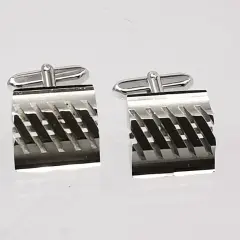 Men's industrial-style stainless steel cufflinks; square shape with an angled parallel ridge design and recessed grooved lines.