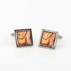 Men’s stainless steel cufflinks with a unique yellow and orange resin sunburst pattern; handmade art-style square cufflink accessories.