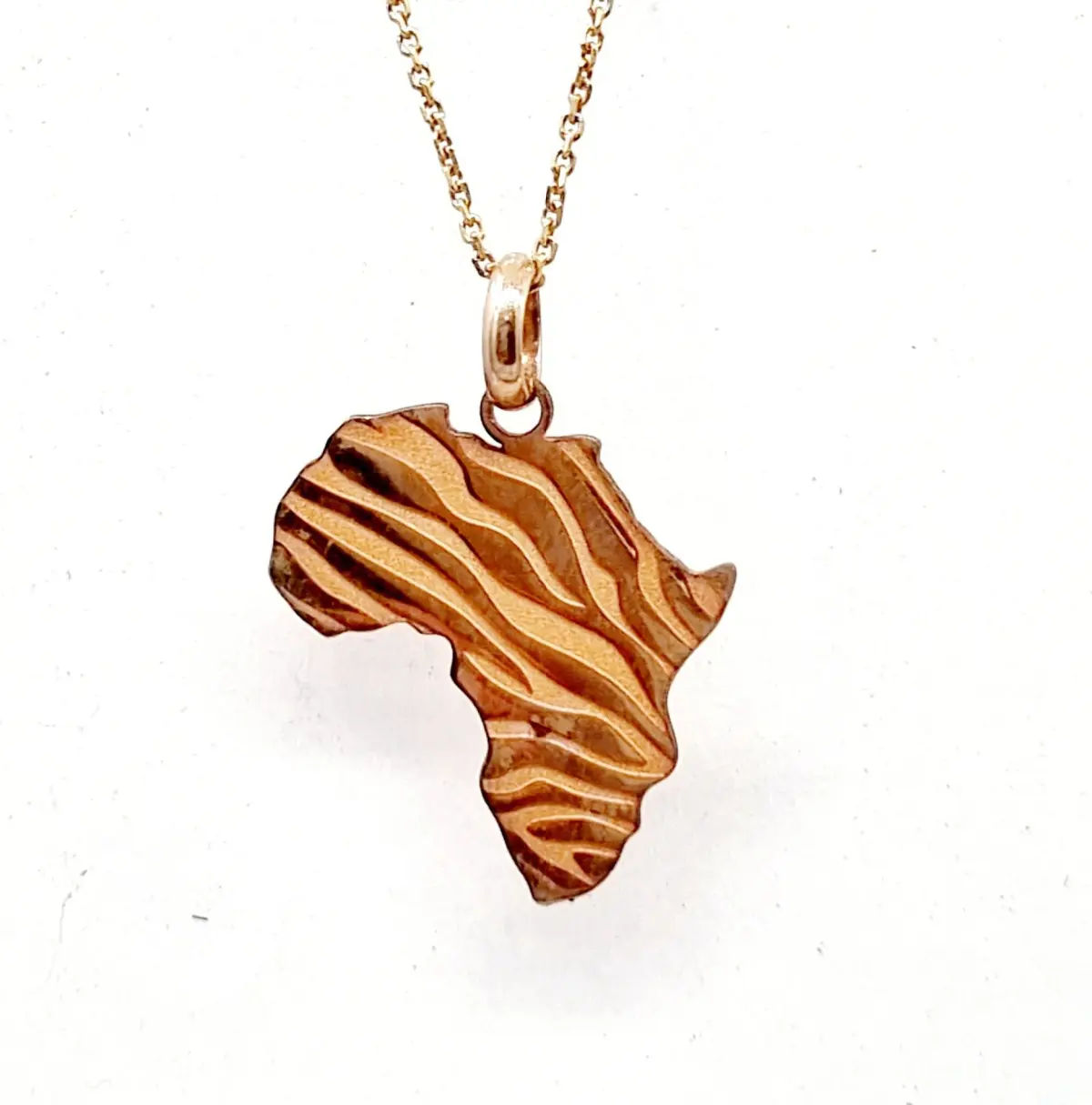 9ct. Yellow Gold Africa pendant with Zebra design on a delicate 9ct. Yellow Gold chain.
