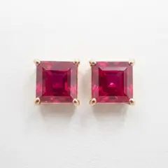 Custom-designed 9ct yellow gold studs featuring vribrant square-cut rubies, perfect for everyday sophistication.