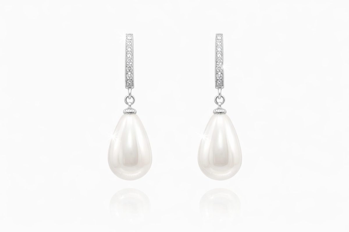 Pair of sterling silver drop earrings featuring lustrous white teardrop shell pearls suspended from cubic zirconia‑encrusted silver bails.