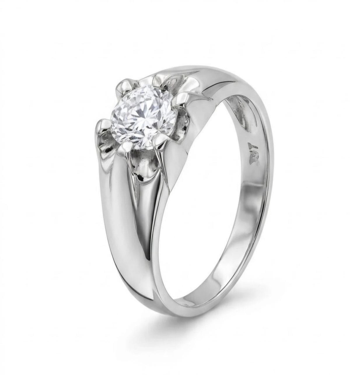 Stering silver solitair engagement ring with round center cubic zirconia-style stone in a decorative claw setting on a sleek silver band.