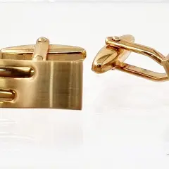 Men's designer gold-plated cufflinks; rectangular waved design with mixed satin and polished finishes for formal wear.