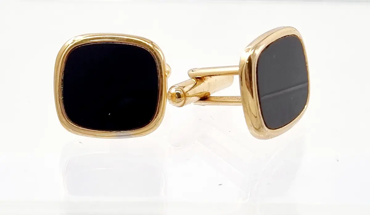 Men's luxury gold-plated cufflinks with rectangular black onyx stone; formal wedding and evening wear accessories.