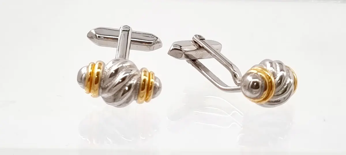 Luxury rugby-themed cufflinks accessory in polished stainless steel with 18ct gold plating; sports-inspired men's jewelry.