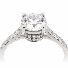 18ct. White Gold Ring featuring a 1.03ct M/I1 centre diamond, surrounded by 30 smaller diamonds with a combined weight of 0.198ct.