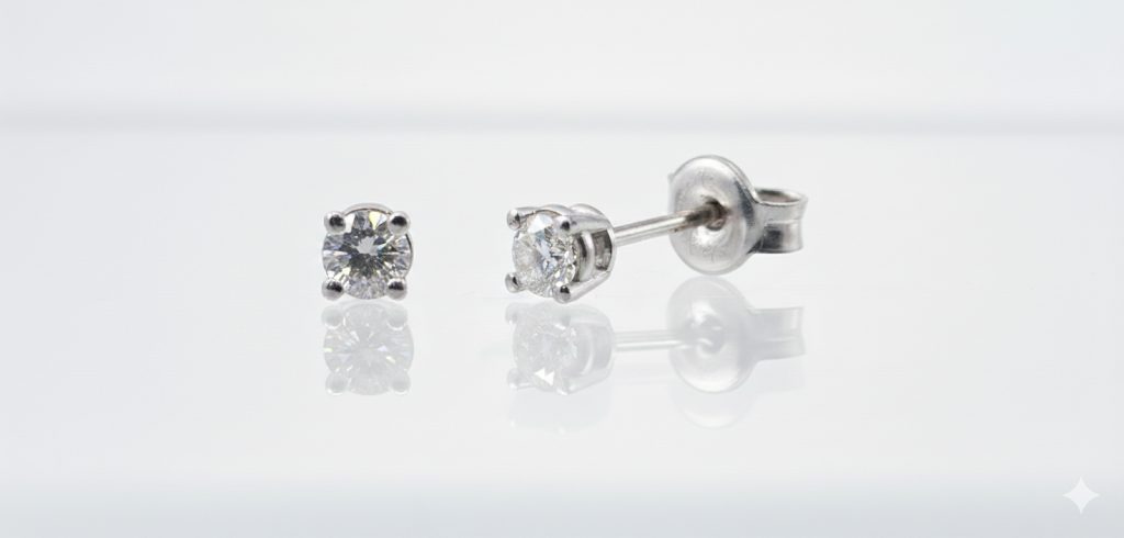 9ct. White Gold 4 claw studs, set with 2 diamonds of 0.18ct. GH, vs and push on butterlies