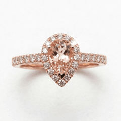 Fine jewellery pear-shaped blush pink morganite engagement ring featuring a sparkling lab diamond band set in rose gold.