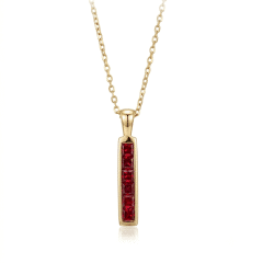 9ct. Yellow Gold vertical bar set with square Rubies, dangling on a 9ct. Yellow Gold chain.