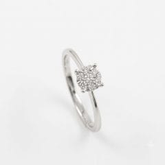 A 9ct white gold cluster ring. It features an array of brilliant round-cut diamonds at the center, set closely together to resemble a larger, square-shaped diamonds. The cluster is secured by a neat, four-claw setting on a delicate, plain gold shank.