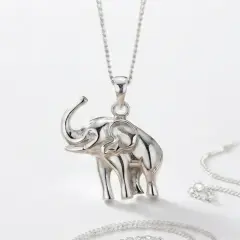 Vimke A studio-style product of a sterling silver elephant pandant hanging from a matching silver chain.