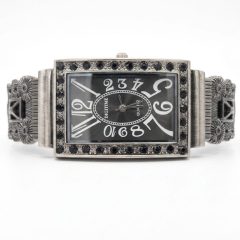 1780662673005 A vintage-style, rectangular Digitime quartz watch with a dark grey dial, featuring oversized numerals and a frame embellished with black Marcasite.