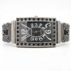 A vintage-style, rectangular Digitime quartz watch with a dark grey dial, featuring oversized numerals and a frame embellished with black Marcasite.