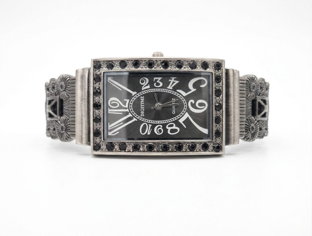 1780662673005 A vintage-style, rectangular Digitime quartz watch with a dark grey dial, featuring oversized numerals and a frame embellished with black Marcasite.
