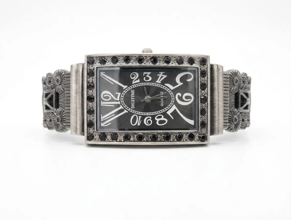 A vintage-style, rectangular Digitime quartz watch with a dark grey dial, featuring oversized numerals and a frame embellished with black Marcasite.