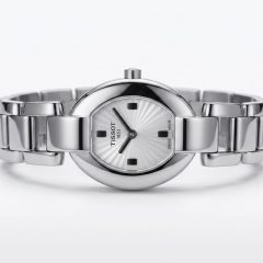 1780663396367 A silver-toned Tissot 1853 woman's wristwatch featuring an oval case, a sunburst patterned dial, and a polished metal link bracelet.