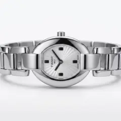 A silver-toned Tissot 1853 woman's wristwatch featuring an oval case, a sunburst patterned dial, and a polished metal link bracelet.