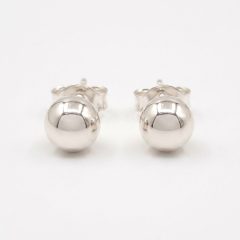 Silver half ball stud earrings, showcasing their polished, reflective metallic surface and simple, elegant design with push on butterflies.