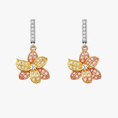Pair of tri‑colour flower earrings with rose and yellow‑gold petals encrusted with cubic zirconia, suspended from a slim white‑gold top bar set with a single row of CZ stones.