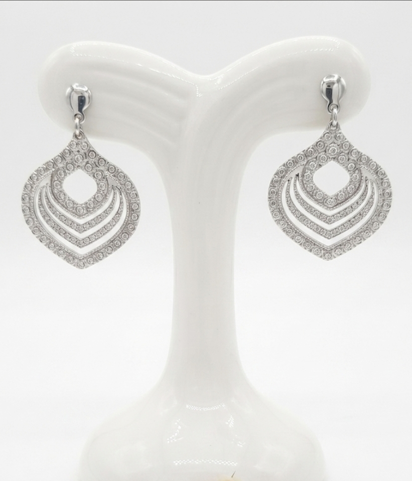 Elegant silver earrings with intricate filigree details, with push on butterflies.