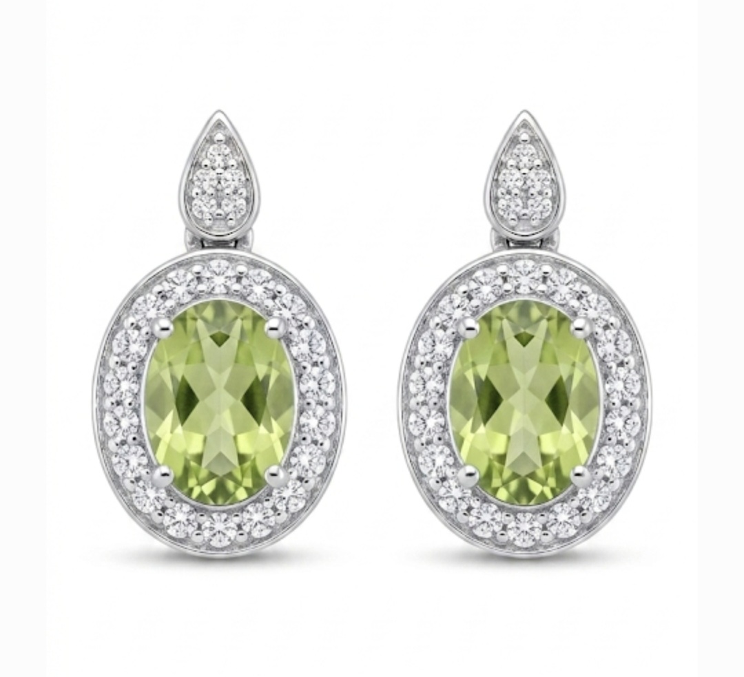Screenshot_20260602_154037_Google(1) A pair of 9ct oval Peridot Gemstone 6.5x4.0mm, surrounded by 36 round diamonds set as pave and 4 round diamonds in a drop shaped stud with butterfly.