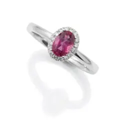 18ct. White Gold Oval Pink Tourmaline, surrounded by a halo of 16 round diamonds of 0.08ct.