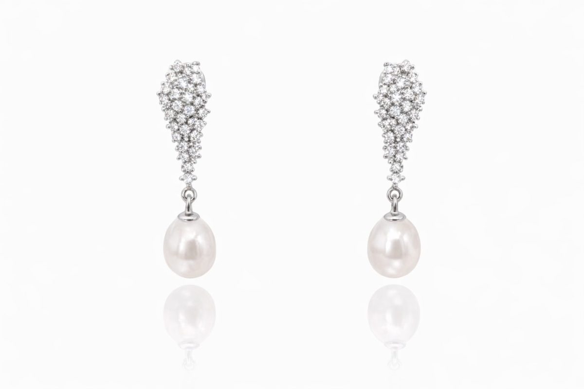 legant sterling silver drop earrings featuring cascading clusters of sparkling cubic zirconia and lustrous white freshwater pearls.