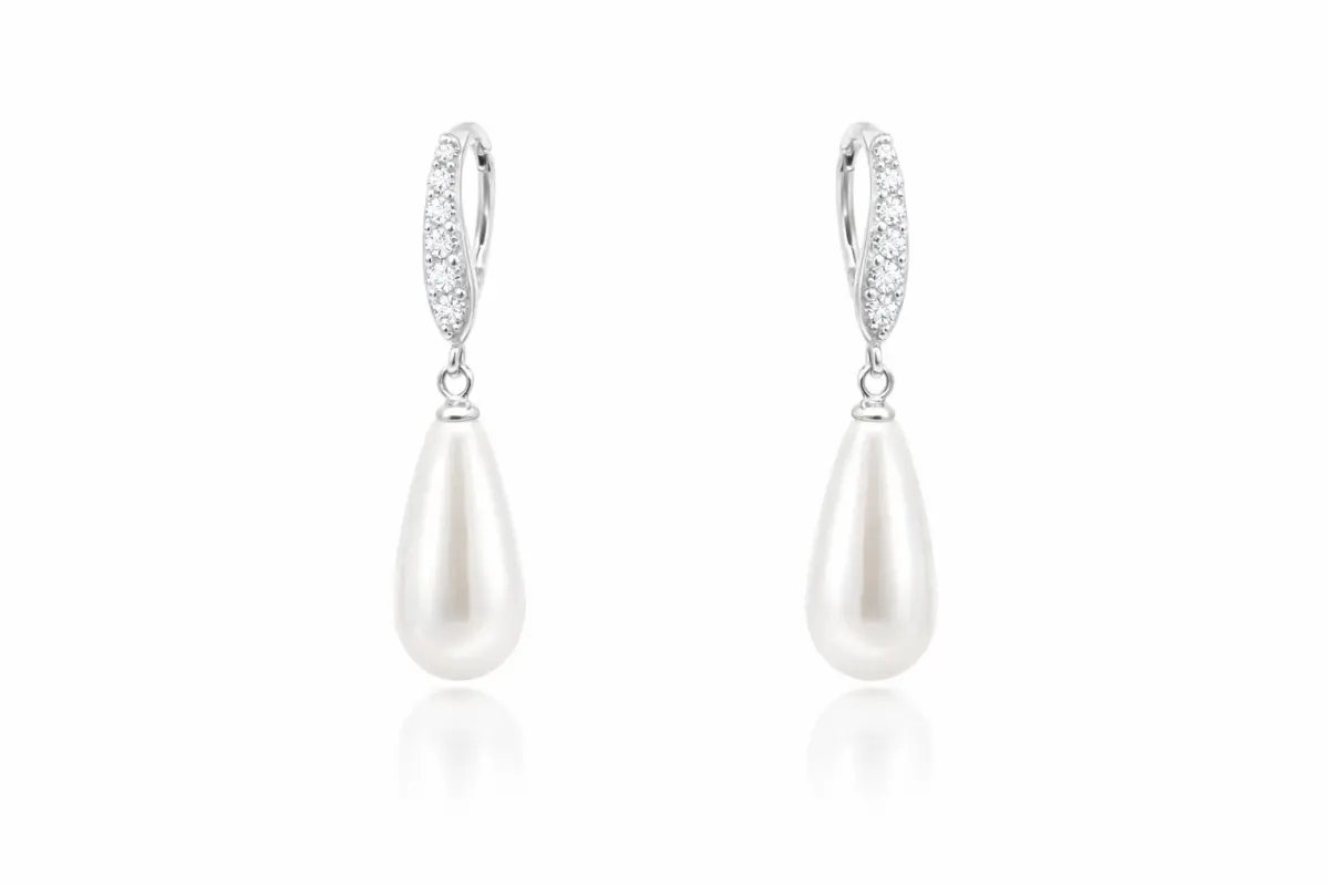 Elegant silver drop earrings featuring sparkling cubic zirconia accents and smooth teardrop-shaped shell pearls.