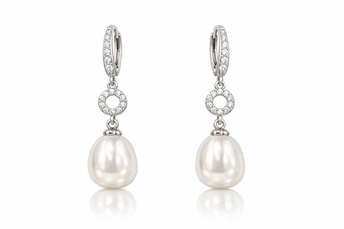 Elegant silver drop earrings with a warm rhodium finish, featuring sparkling cubic zirconia circles and shorter, wider freshwater pearls