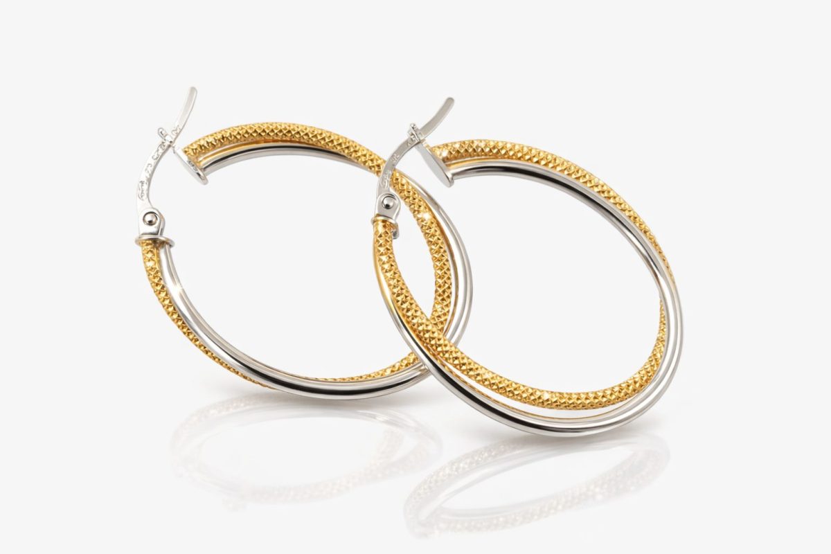 Elegant two‑tone hoop earrings crafted in polished white gold and textured yellow gold.