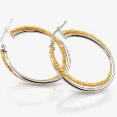 Elegant two‑tone hoop earrings crafted in polished white gold and textured yellow gold.