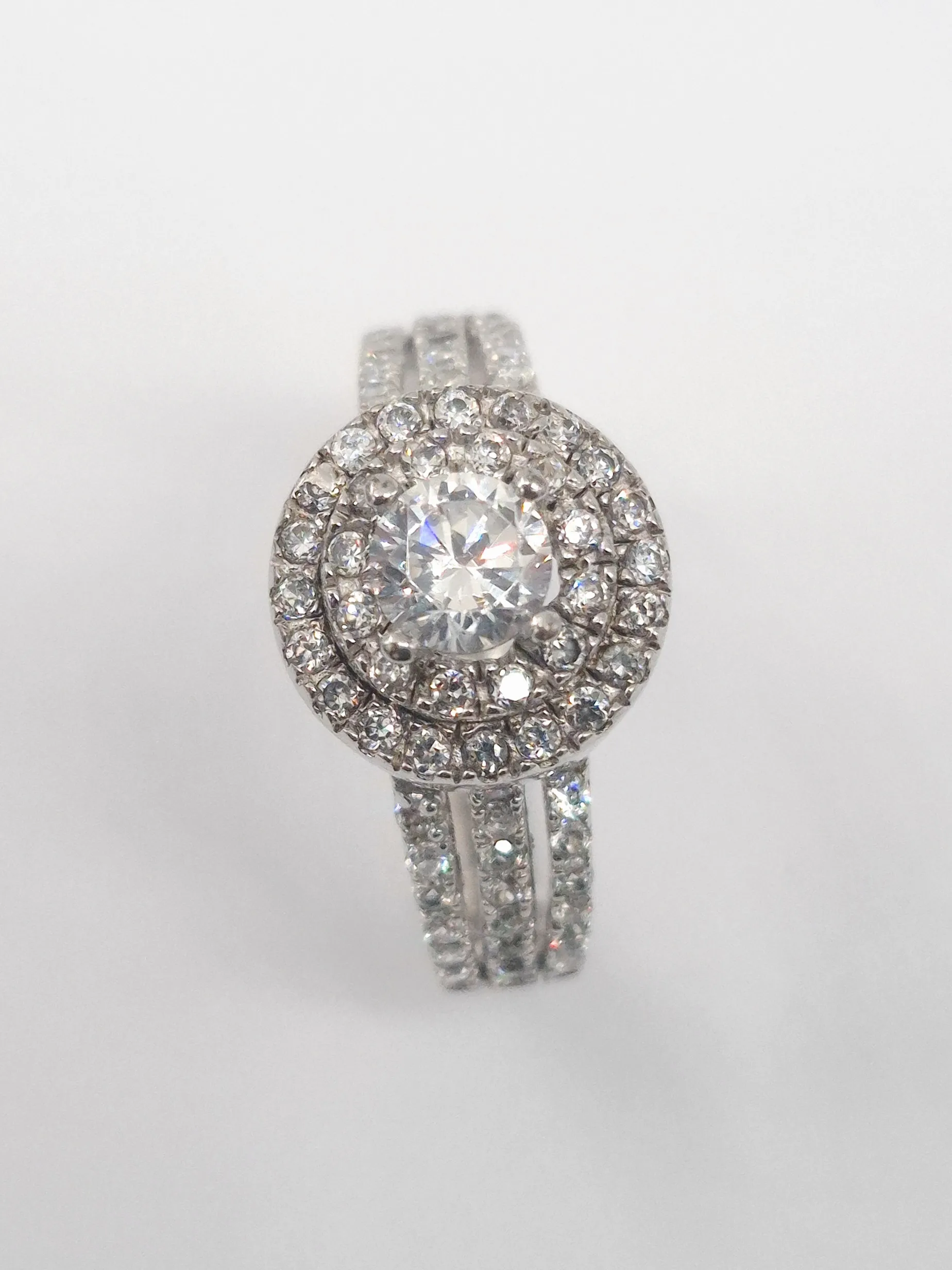 Diffany bespoke engagement ring featuring a stunning oval blue sapphire.