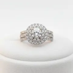 A double-halo Cubic Zirconia ring in Sterling silver, with a triple pave-set band.