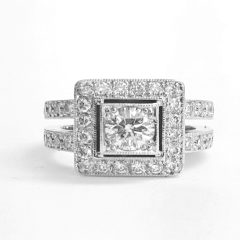 18ct. White gold ladies dress ring set with round brilliant cut diamond of o.47ct. I,vs1 surrounded by 20 round brilliant cut diamonds of 0.40ct and in double shank 20 diamonds of 0.40ct.