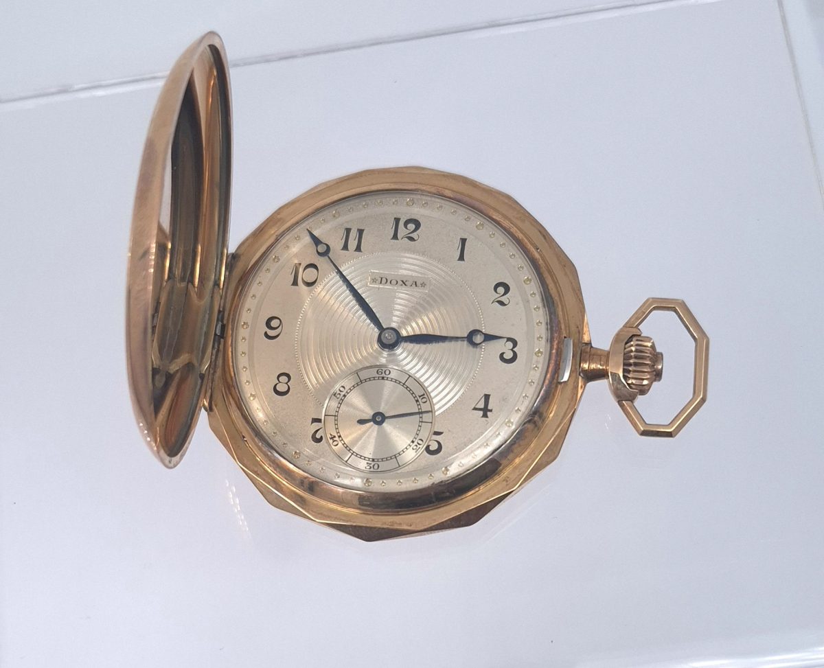 This 14ct. Yellow gold pocket watch, has a well-preserved Art Deco dial with a sunburst guilloche pattern and a clean sub-dial, which adds a premium for collectors.