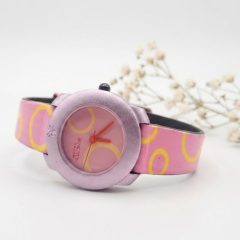1780417262389 Benetton by Bulova quartz watch with a pink and yellow patterned strap.