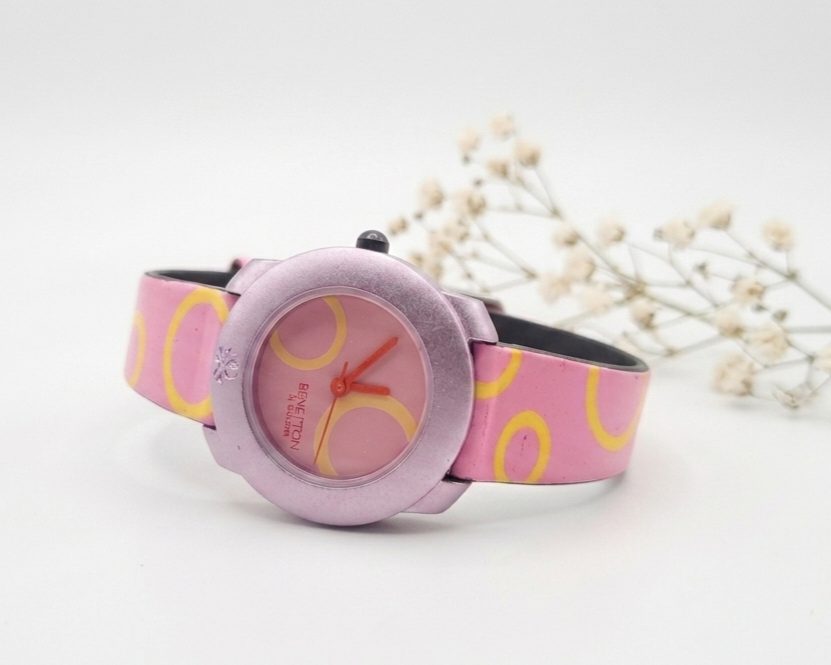 1780417262389 Benetton by Bulova quartz watch with a pink and yellow patterned strap.