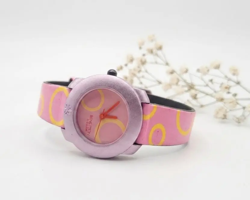 Benetton by Bulova quartz watch with a pink and yellow patterned strap.