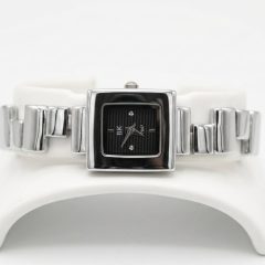 A sleek, professional product of a modern square-faced silver colour watch with a black dial.