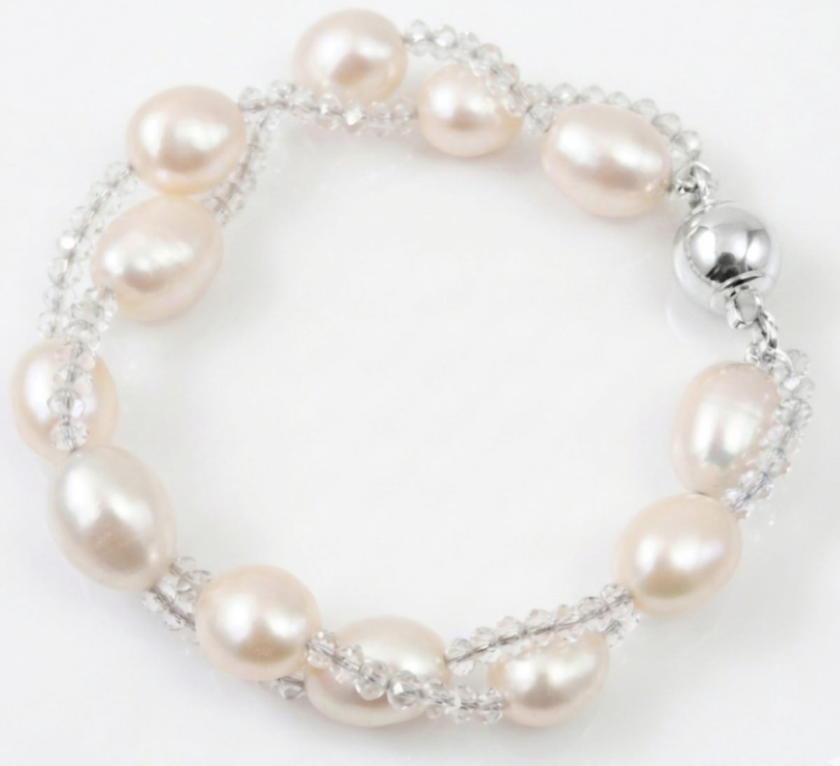 Screenshot_20260604_160713_Gallery(1) Elegant twisted freshwater pearl and crystal bracelet with a silver fish hook clasp, perfect for bridal or formal wear.